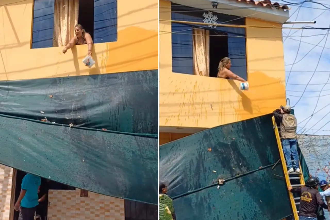 Autoridades le retiran toldo por invadir la calle y mujer los recibe a baldazos